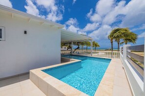 Poolside perfection! Experience ultimate comfort and luxury in our dreamy pool area.