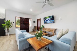 Stylish and inviting! Experience a delightful stay in the comfort of our living room.