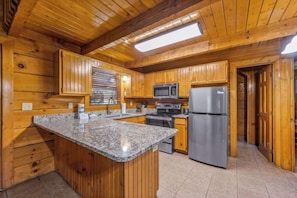 Granite counters and stainless steel appliances make cooking on vacation easy!