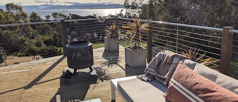 Recline on the outdoor lounges and take in the view back to mainland Tasmania