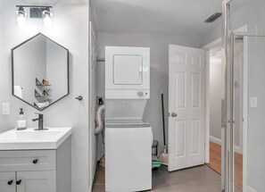 Stackable Washer and Dryer Located in Bathroom off of Dining Room