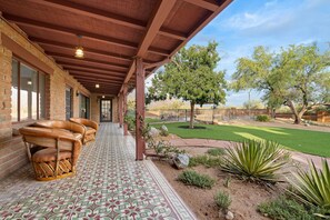 Backyard: Equipale seating in the shade of the long porch