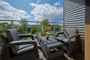 The balcony's peaceful ambiance is ideal for unwinding. 