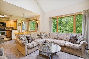 While relaxing on the large sofa, enjoy the view out of the spacious windows.