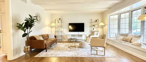 Beautiful living room with bow window seating. 