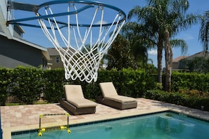 Enjoy the perfect balance of activity and leisure by our pool with a unique basketball hoop. Lounge on the sunbeds after a friendly game, surrounded by the privacy of lush greenery