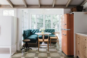 Patterned floors and a charming palette provide the utmost in cottage comfort.