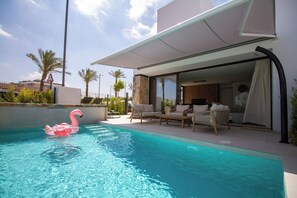 Private swimming pool with lounge area