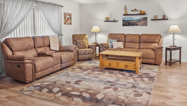 Spacious living room with open design to kitchen area