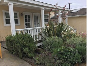 Guest bedrooms open to side deck in the back yard.