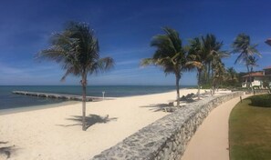 White sand beach is great for walks into Barker's  Park located next door