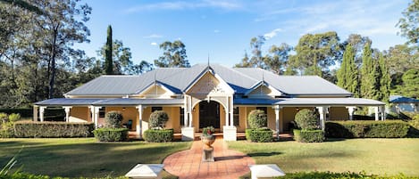 front of house, with expansive lawn