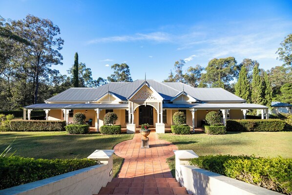 front of house, with expansive lawn