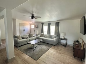 Comfortable living room space with a 60” inch tv 