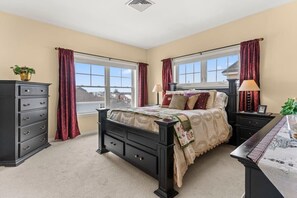 Primary bedroom with a queen-size bed and ensruite bathroom