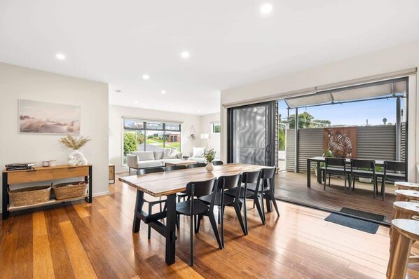 Abundant natural light floods the space, with easy flow to the deck