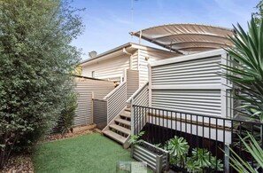 Small rear yard with synthetic turf