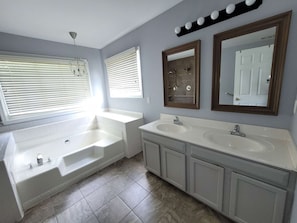 The spacious bathroom and shower in the masters bedroom will have you feeling refreshed and relaxed.