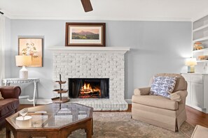 Wood burning fireplace in the snug
