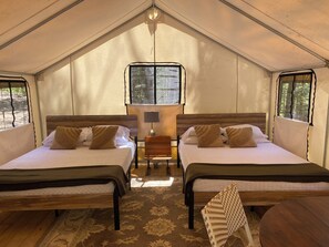 Discover Comfort and Convenience in our Glamping Tent. Two Queen Beds, Coffee Bar, Fresh Towels, and All the Essentials for Your Perfect Stay. Bring your favorite food for the grill and marshmallows for the campfire. Firewood is available for you to purchase for $5.  