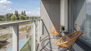 The balcony provides a serene environment for relaxation. 