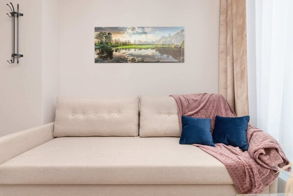 The living area's modern and stylish decor creates a welcoming atmosphere. 