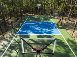 Sport Court: Slam dunk and serve up fun on this multi-sport court in nature's embrace!