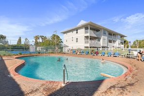 Immerse yourself in the massive outdoor swimming pool with friends and family