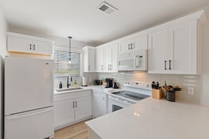 Elevate your cooking experience with our bright and spacious kitchen