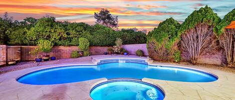 Enjoy the pool with waterfall and hot tub