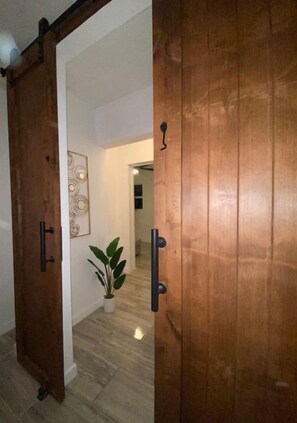 Master bedroom, custom solid cherry oak barn door. 
