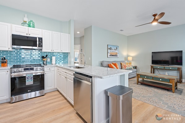 Updated Stainless Steel Kitchen and Living Room Area