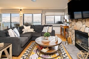 Cozy living room looks out onto the Lake