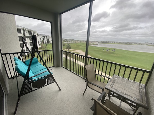 Rare lanai w screen on 2 sides overlooking hole 9 &  west and water!! A SWING!