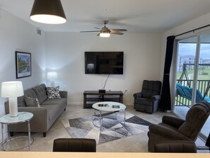 65 inch TV and comfy LR!!  