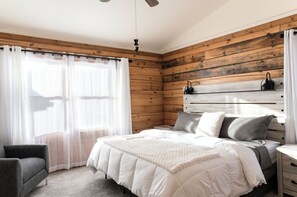 Upstairs bedroom with 1 king size adjustable sleep number bed.