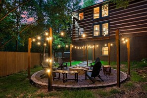 Enjoy the mountain air while relaxing around the large fire pit.