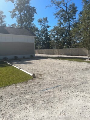 Gravel Parking area to the right of front porch… Room to park boat trailer.