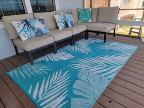 outdoor couch on an XLarge Porch overlooking the water