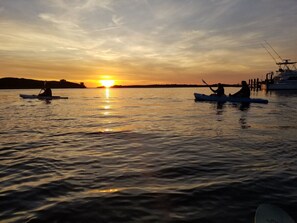 kayak at sunrise or sunset (lights reqd at night)