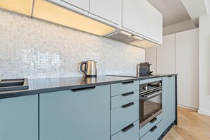Whip up a feast in our fully equipped kitchen with a touch of modern elegance.