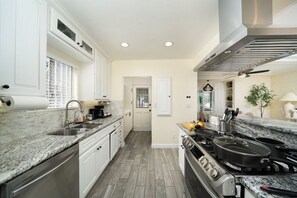 Step into our fully-equipped kitchen - Including Spice Rack, Coffee and Tea Station.