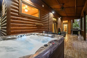 Relax and rejuvenate in style with Tucker'd Out's inviting hot tub situated on the deck.