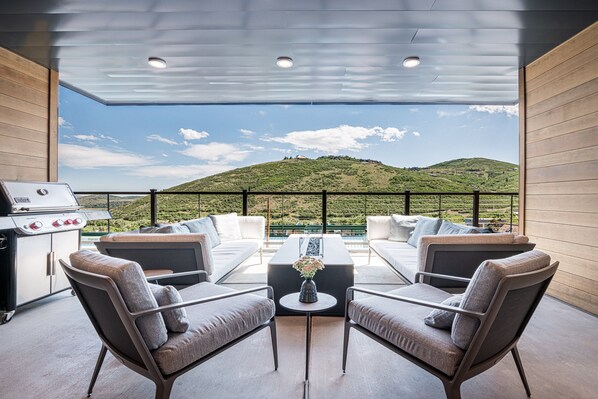 Private covered deck with stunning mountain views