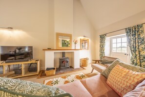 Water Mill House, Burnham Overy Staithe: The sitting room has dual aspect river views