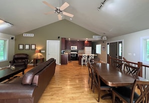 Great room with living, dining and kitchen spaces.