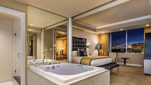 Hot Tub with Sliding Door | King Bed with  Las Vegas Dusk View