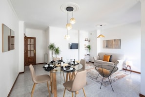 Our spacious living area counts with a dining table, perfectly suitable for four people, so you can enjoy your homemade meals with the ones you love #bright #wonderful