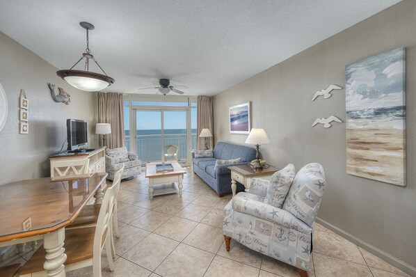 The ocean front living room is well-appointed with comfortable furnishings.