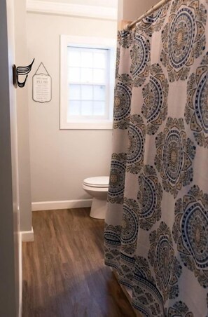 Beautifully renovated bathroom with walk in shower and laundry room. 